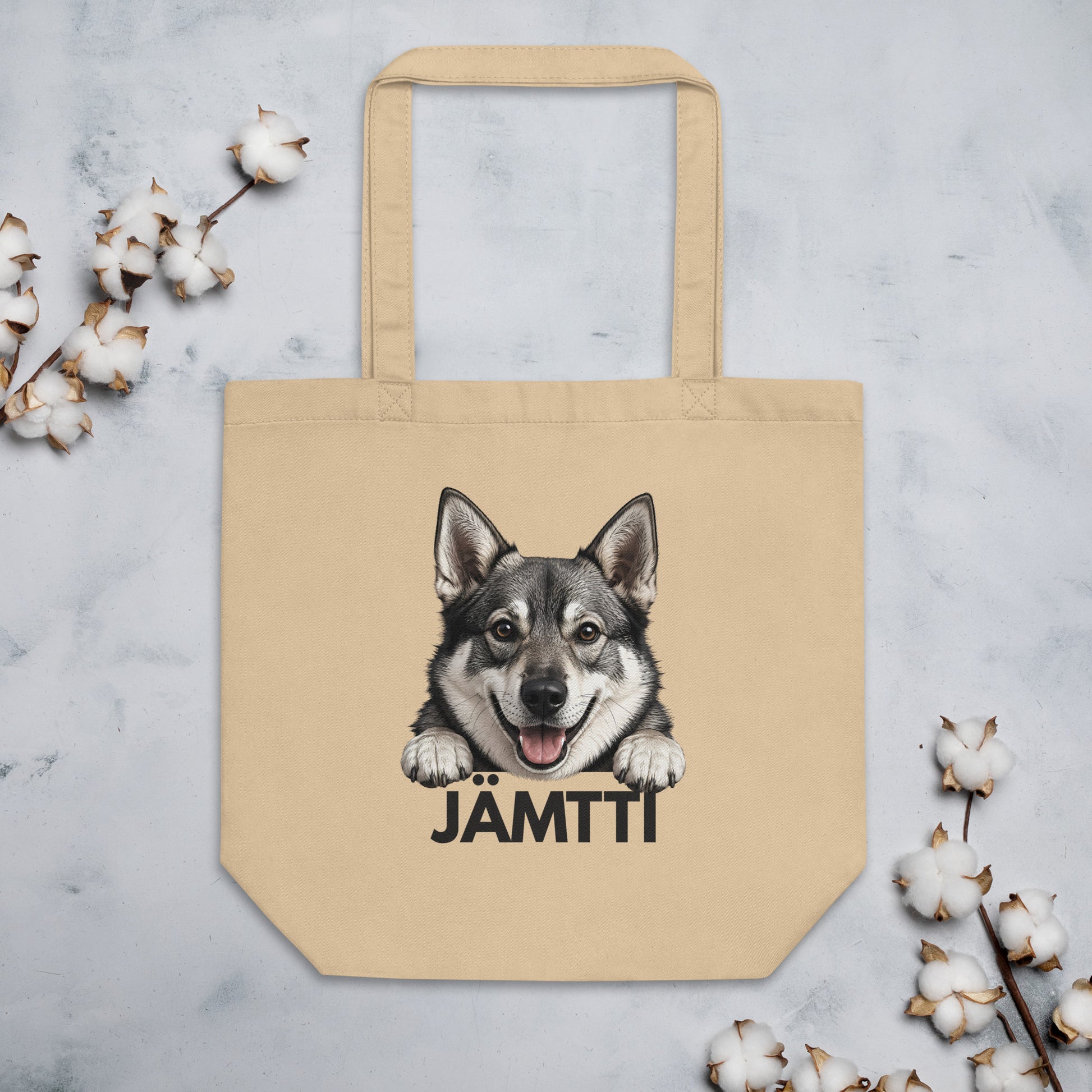 Jämtlanninystykorva-kangaskassi ja koristeita.