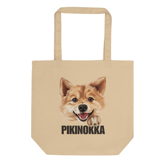 Ekologinen beige kangaskassi, jossa suomenpystykorvan kuva ja ruskea teksti "pikinokka".
