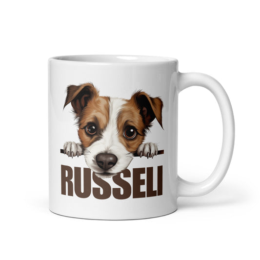 Kiiltävä valkoinen muki, jossa kurkkaava jackrussellinterrieri ja ruskea teksti "russeli".